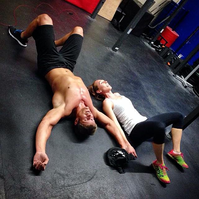 Dai and Christie Manuel on the gym floor after a workout